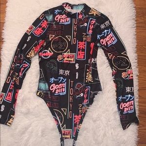 Black body suit with bright neon decor